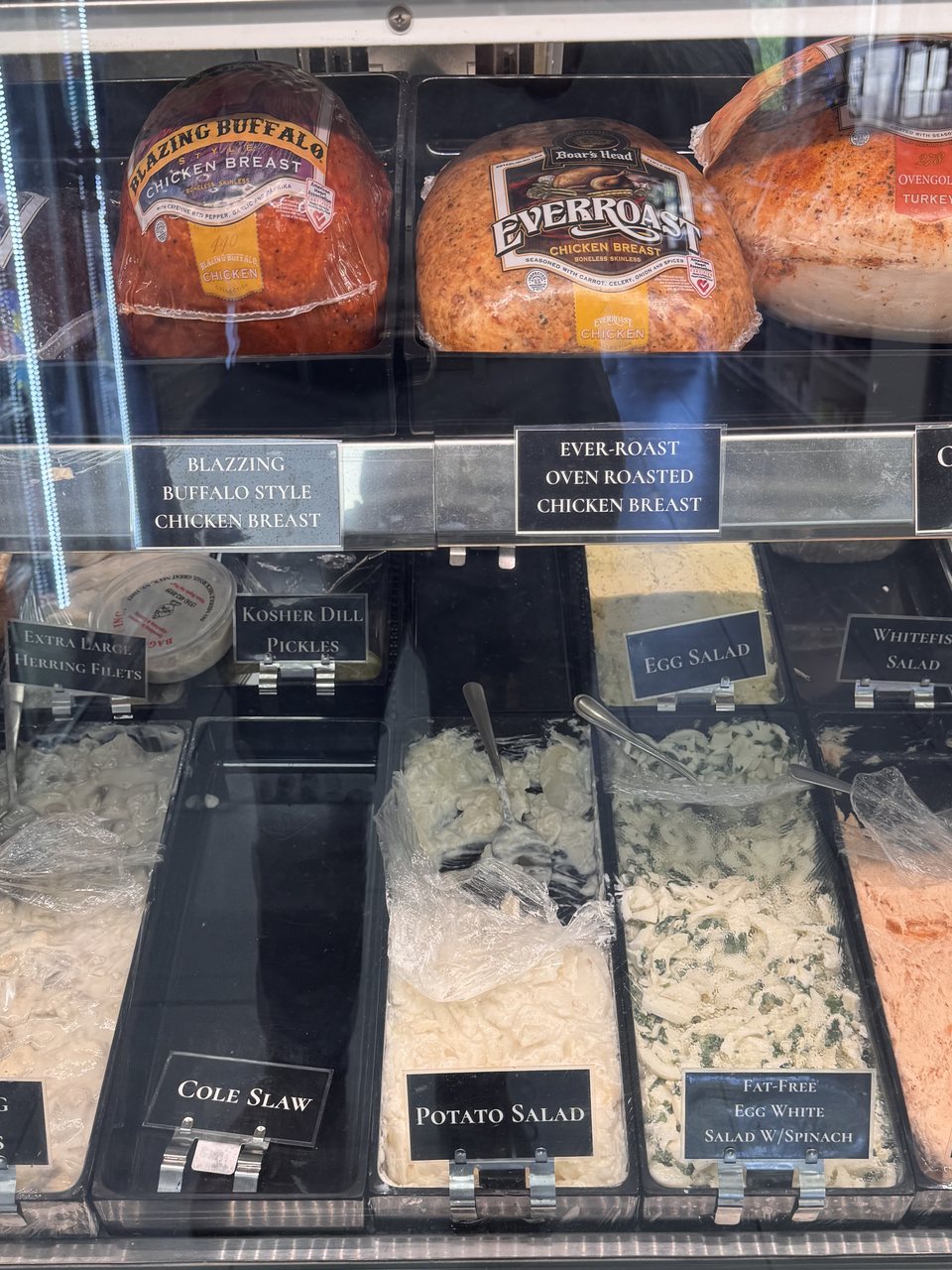 Boar's Head deli meats and house salads — egg, potato, whitefish, baked salmon