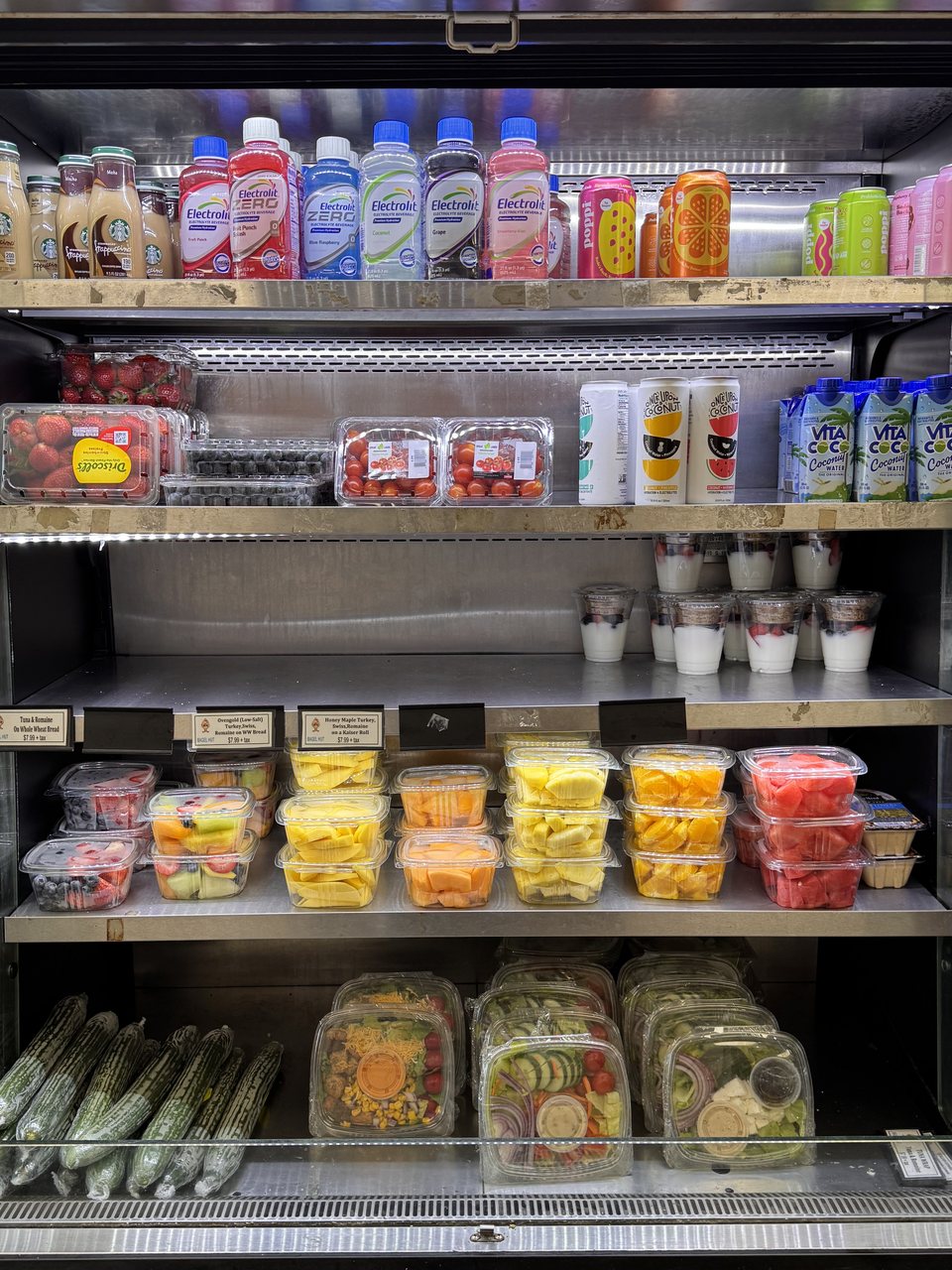 Grab-and-go cooler — $7.99 sandwiches, fruit cups, parfaits, salads