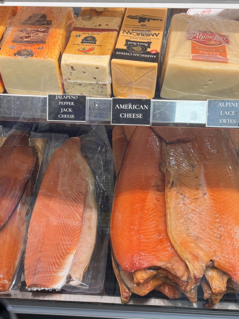 Smoked fish counter — nova, kippered salmon and sliced cheeses